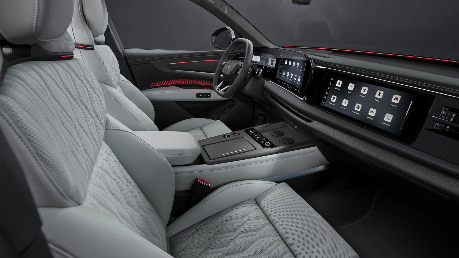 Habitacle officiel de l’Audi Q9 avec sièges avant et trois écrans